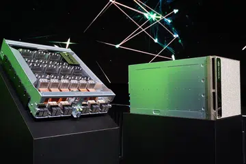 The NVIDIA DGX-2 supercomputer and half its first layer of innards exposed.