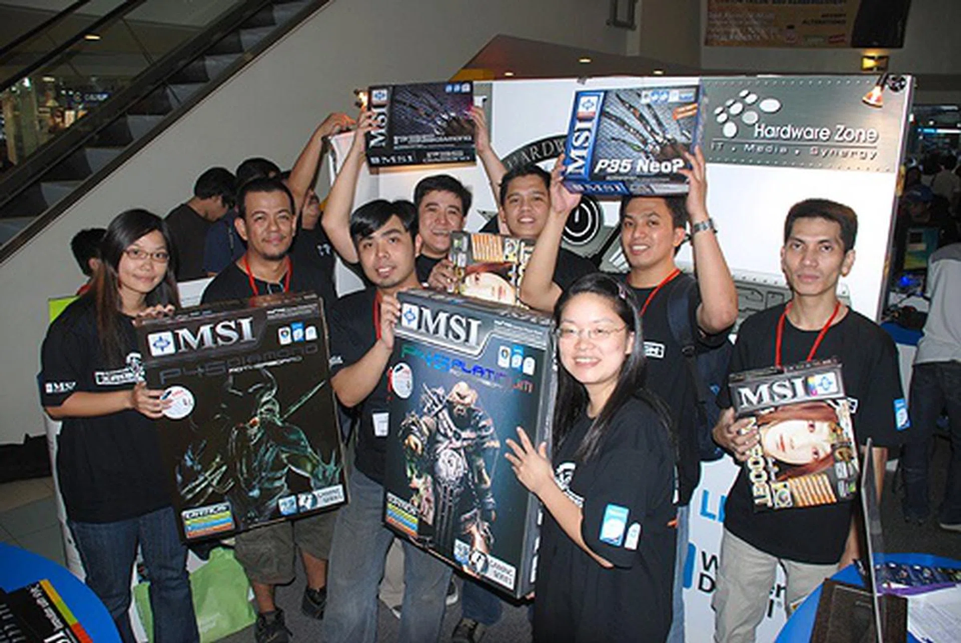  And speaking of not going home empty-handed, HardwareZone and MSI also raffled off more motherboards and graphics cards for the bottom four. They get another photo-op with the lovely ladies of MSI, to boot! Everyone's a winner!  