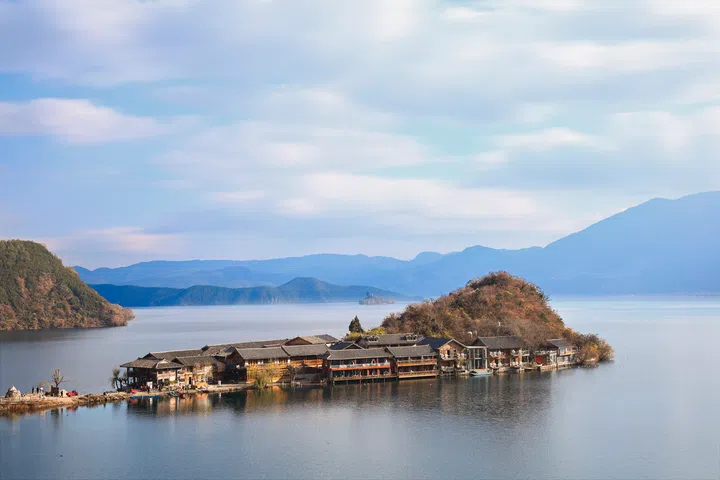 Iconic landmark scenery of Lugu Lake, located in the northwest of the Yunnan plateau, is also called the "mother lake" by the local Mosuo people..  China