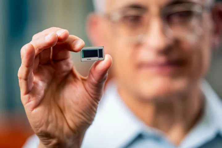 Hamid Azimi, corporate vice president and director of substrate technology development at Intel Corporation, holds an Intel assembled glass substrate test chip at Intel's Assembly and Test Technology Development factories in Chandler, Arizona. (Source: Intel)