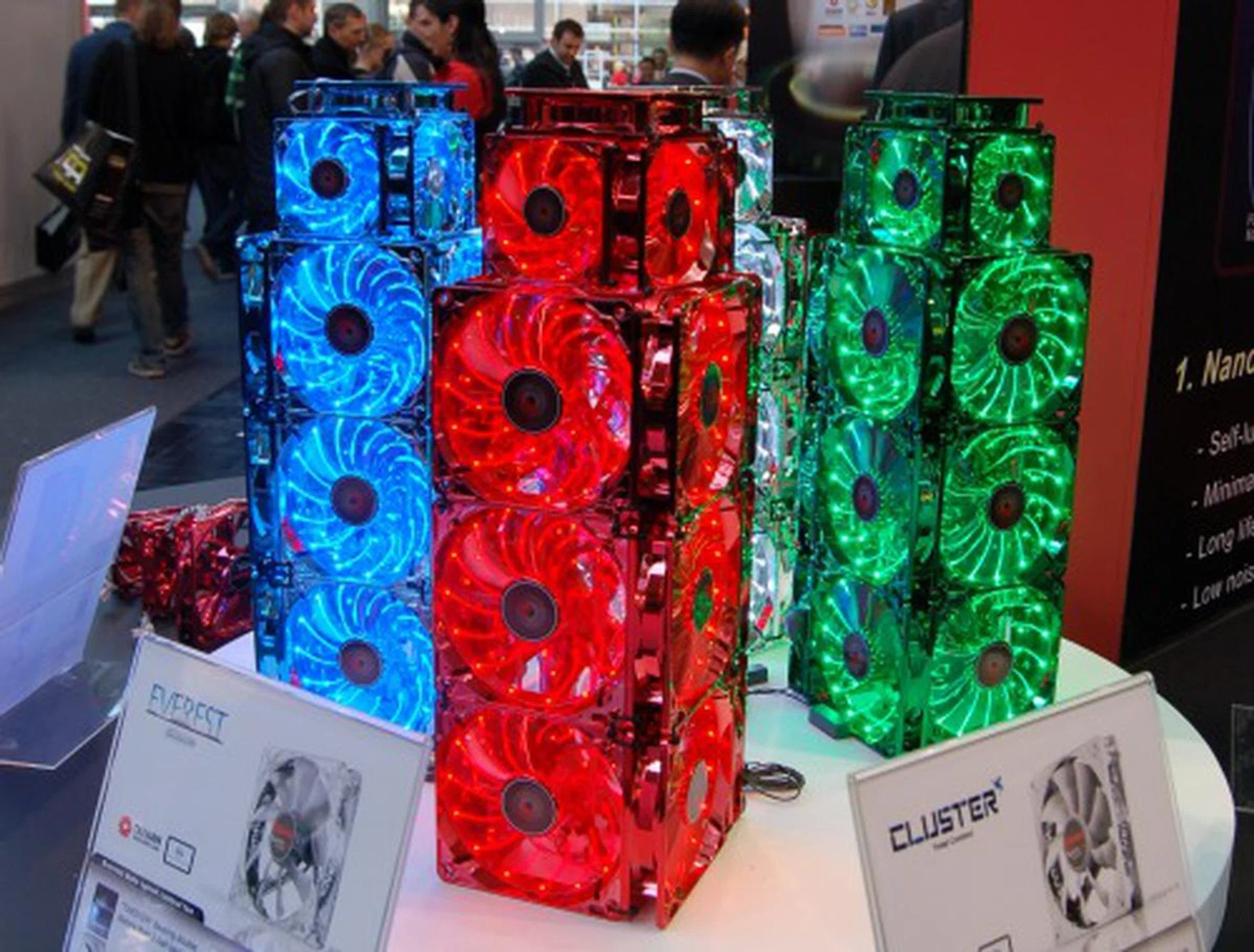  These are their new Apollo casing fans (ignore the Everest and Cluster fan labels which are not shown in this photo). The Apollo is the most expensive of their casing fans and it incorporates three great features. Firstly, the fan blades and frame bear a new metallic coating for the sparkling finish and offers corrosion protection. Secondly, the fan uses Twister bearing technology (a nano magnetic design, more on this later) for extremely long life span and detachable blades for easy cleaning. Last but not least, the cool lighting you see - Enermax calls it Apollo lighting effect and it is really better than any LED lighting effect we've seen to date. There are 12 LED lights in total per fan.  