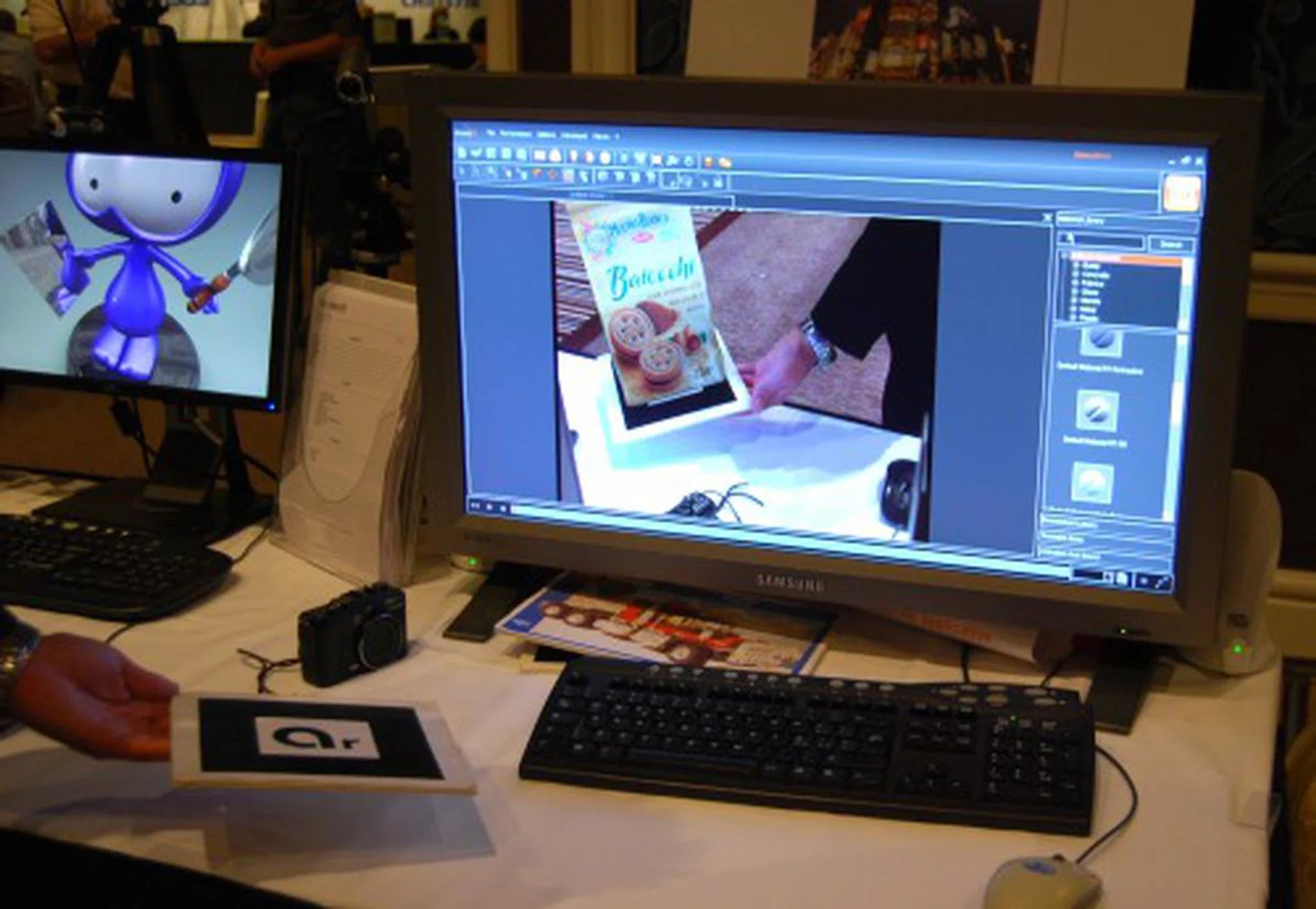 Here we have showcase of augmented reality taking place - we were so busy the whole day if only that pack of cookies were real! This booth setup was from seac02 promoting their linceo release 3.1 software.