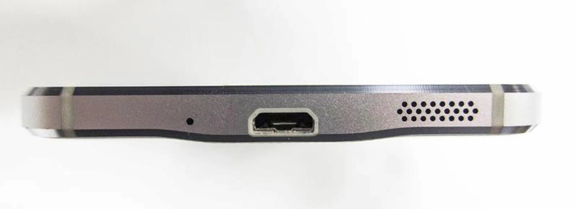 The mono speaker at the bottom edge of the phone.