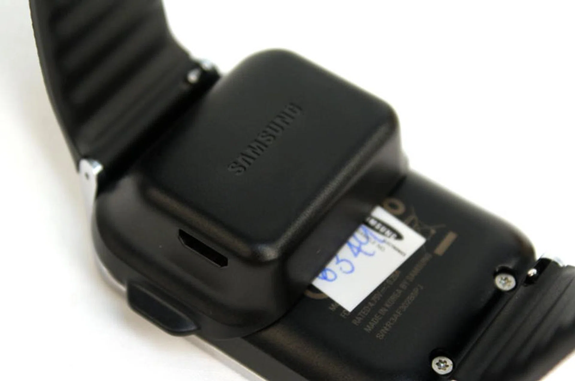 The charging dock snaps onto the back of the watch.