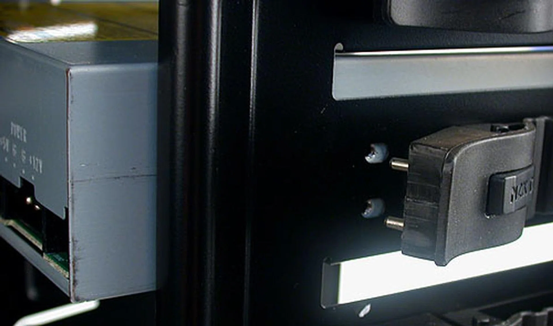 The 5.25-inch external drive bays are secured by NZXT's own tool-free mechanism. Align them to the screw holes on the drive, snap them in and then lock.