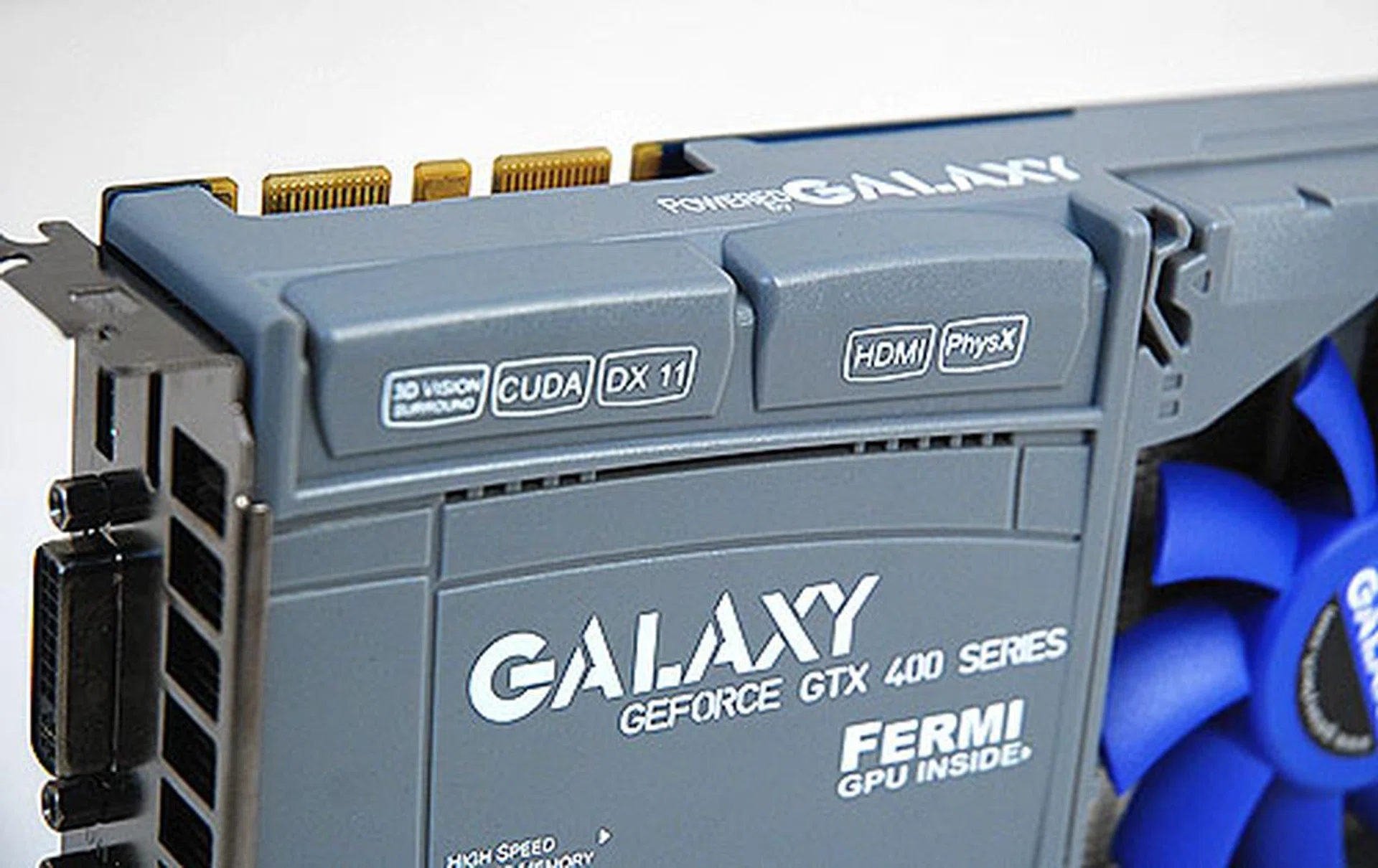 The cooler, though looking too much like a toy with all that plastic, is rather funky looking, with all the labels proclaiming the prowess of NVIDIA's latest Fermi GPU. Here, we can also see the two SLI connectors.