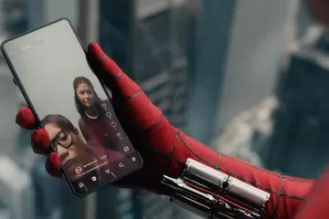 Spider-Man holding a Samsung Galaxy Z Flip model.