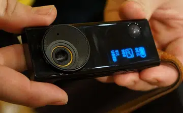 Behold the Autographer - the world's first wearable camera. It has a custom 136-degree eye view lens, an ultra compact GPS unit and 5 built-in sensors. Using a secret algorithm along with input from its sensors,  it tells the camera exactly the right moments to take photos to give you unique candid memories.