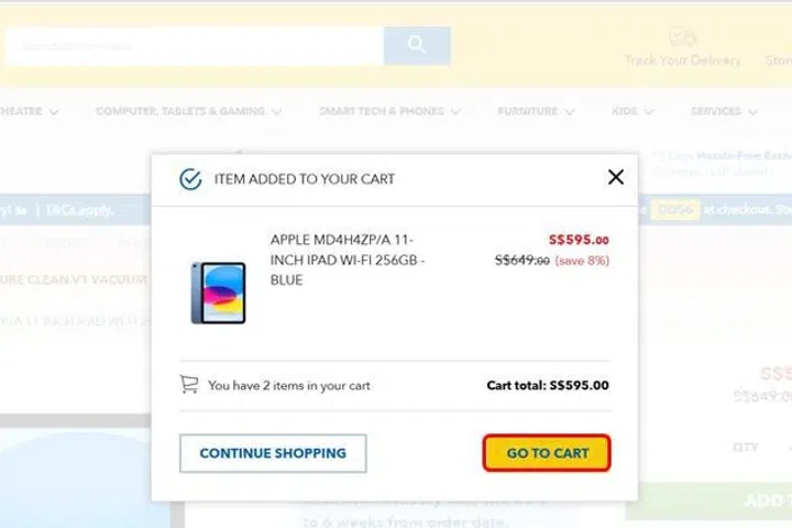 Screenshot shows what happens when the “add to cart” button is clicked. A window pops up showing that the iPad has been added to cart. Nothing is mentioned about an additional Acer vacuum cleaner being added in the window. The “cart total” also does not include the cost of the Acer vacuum cleaner.