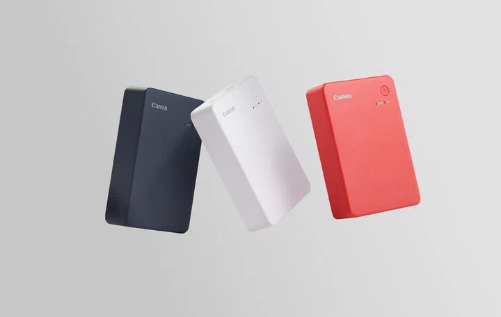 Canon Selphy QX20 in Dark Grey, Sand White, and Terracotta Red. Image: Canon.