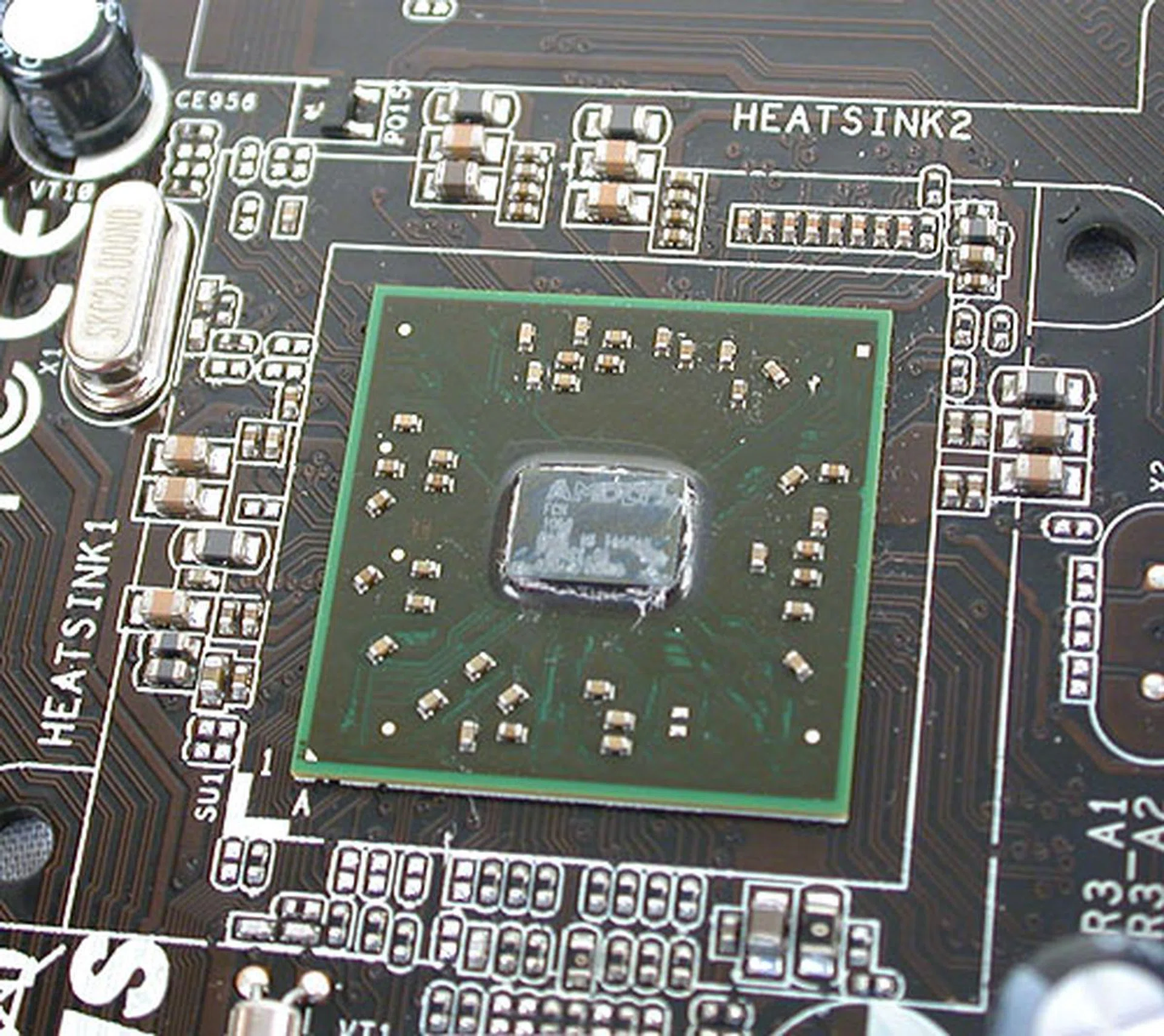 The AMD Hudson chipset that provides the SATA 6Gbps support, PCIe 2.0 lanes and the USB ports looks even smaller than the Zacate APU, though it's manufactured on a 65nm process.