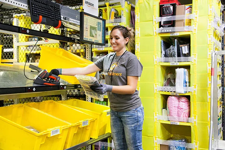 An Amazon employee picking out a product at one of Amazon's Fulfilment Centers. Amazon customers depend on authentic reviews to make their buying decisions, which is why Amazon is determined to crack down on fraudulent practices. (Image Source: Amazon)