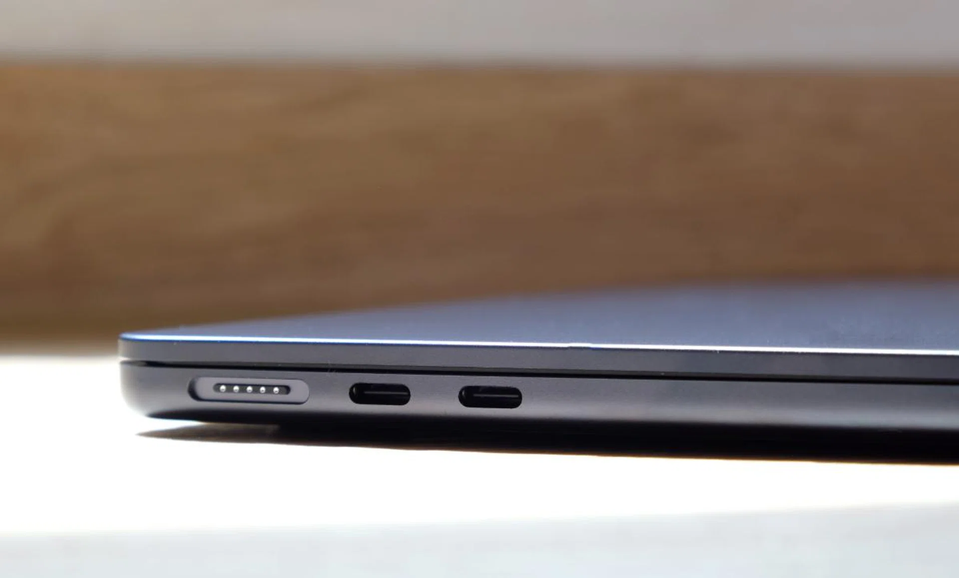 The ports are on the left side. Note also how thin the MacBook Air is.