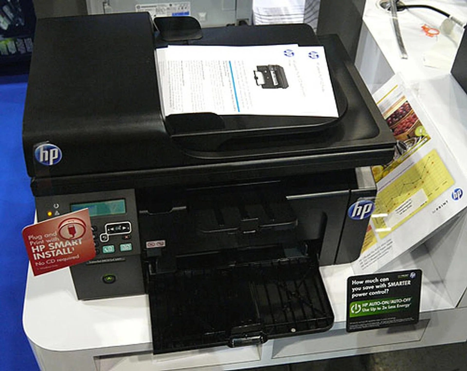 The HP LaserJet Pro M1212nf AIO printer is one of HP's newer products at the PC Show and costs $378 with a free trolley thrown in.
