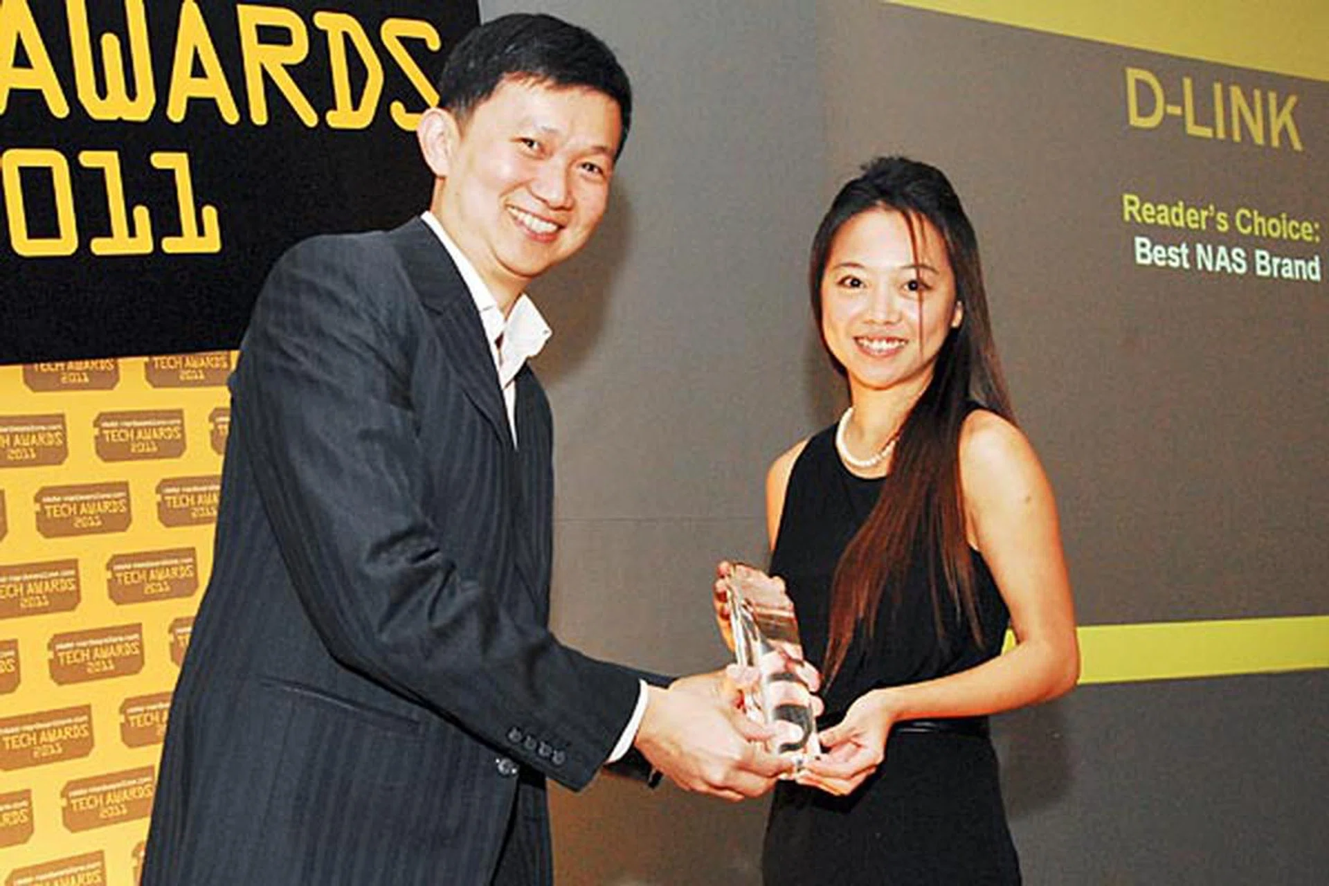 D-Link was voted by the readers as the best NAS brand. Here's Kat Ang, Account Manager for D-Link, accepting the award.