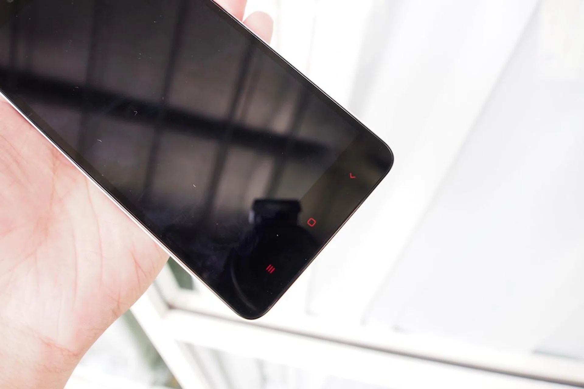 The phone still has their signature red soft-touch menu icons.