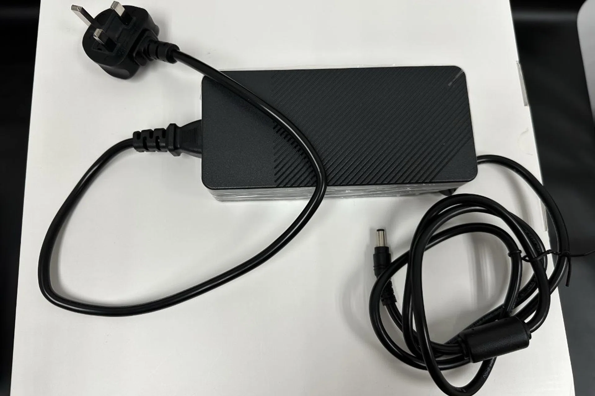 The heavy power brick. 