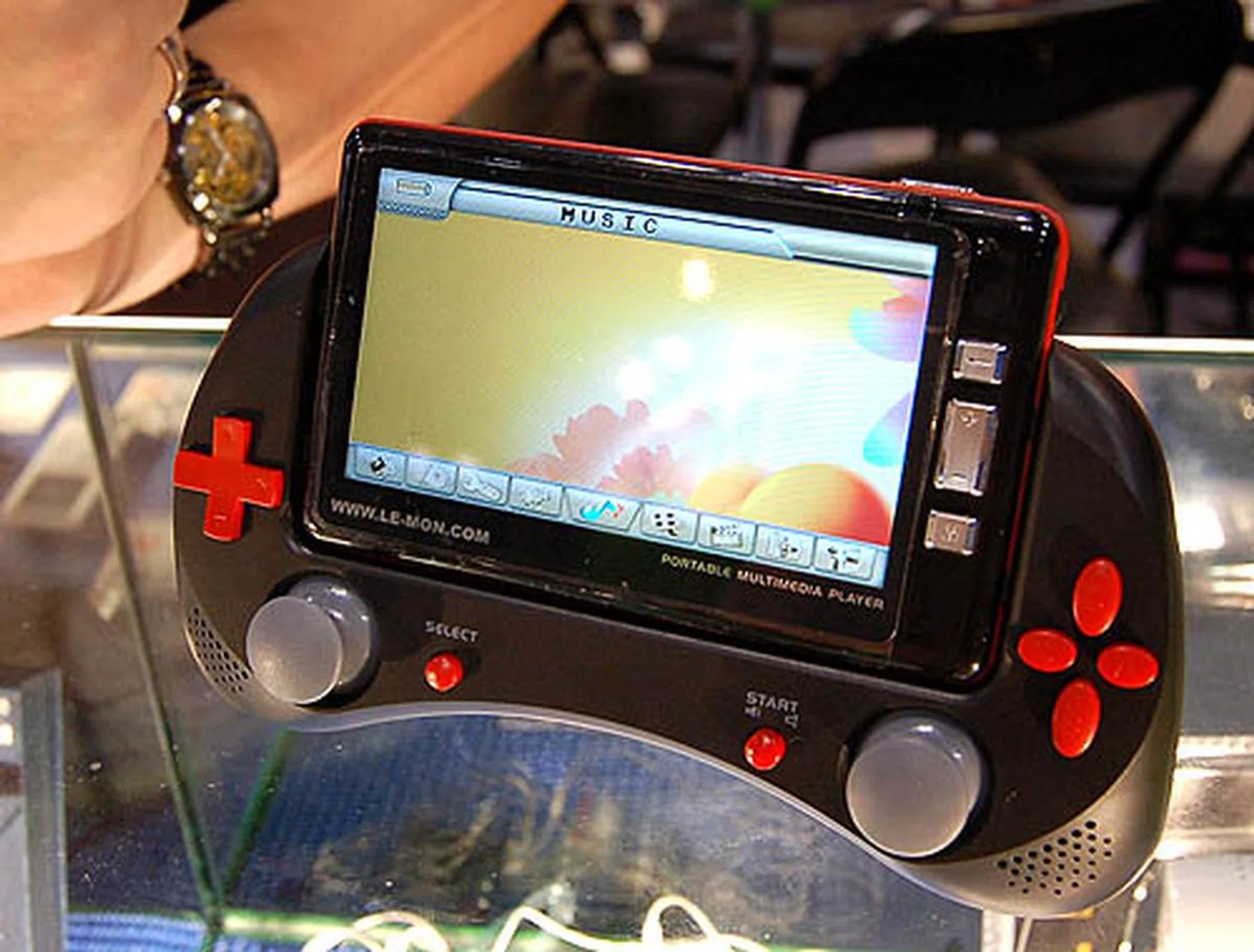  The Xcite-7000 is LeMon's latest offering. This unique gadget can play MP3s, videos, record voices, image files and even play downloaded NES games on its 4.2-inch LCD display. Note that the screen itself can be detached from the controller to double as a sleek, portable media player. The 1GB and 2GB version goes for S$399 and S$459 respectively.  