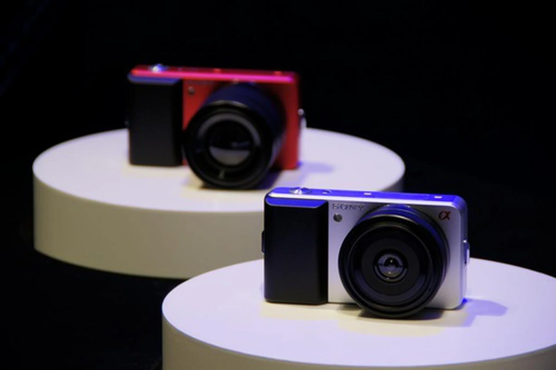 Two of the new concept cameras on display, one red and one silver.