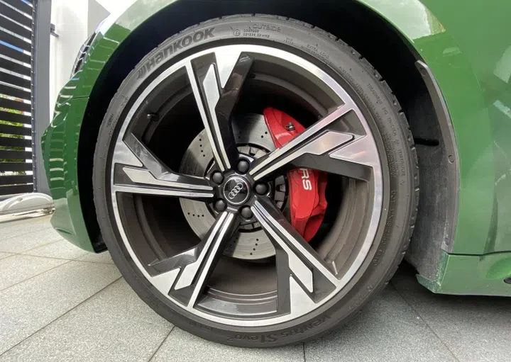 20-inch wheels and steel brakes are standard. Ceramic brakes are a S$28k option. Ouch.