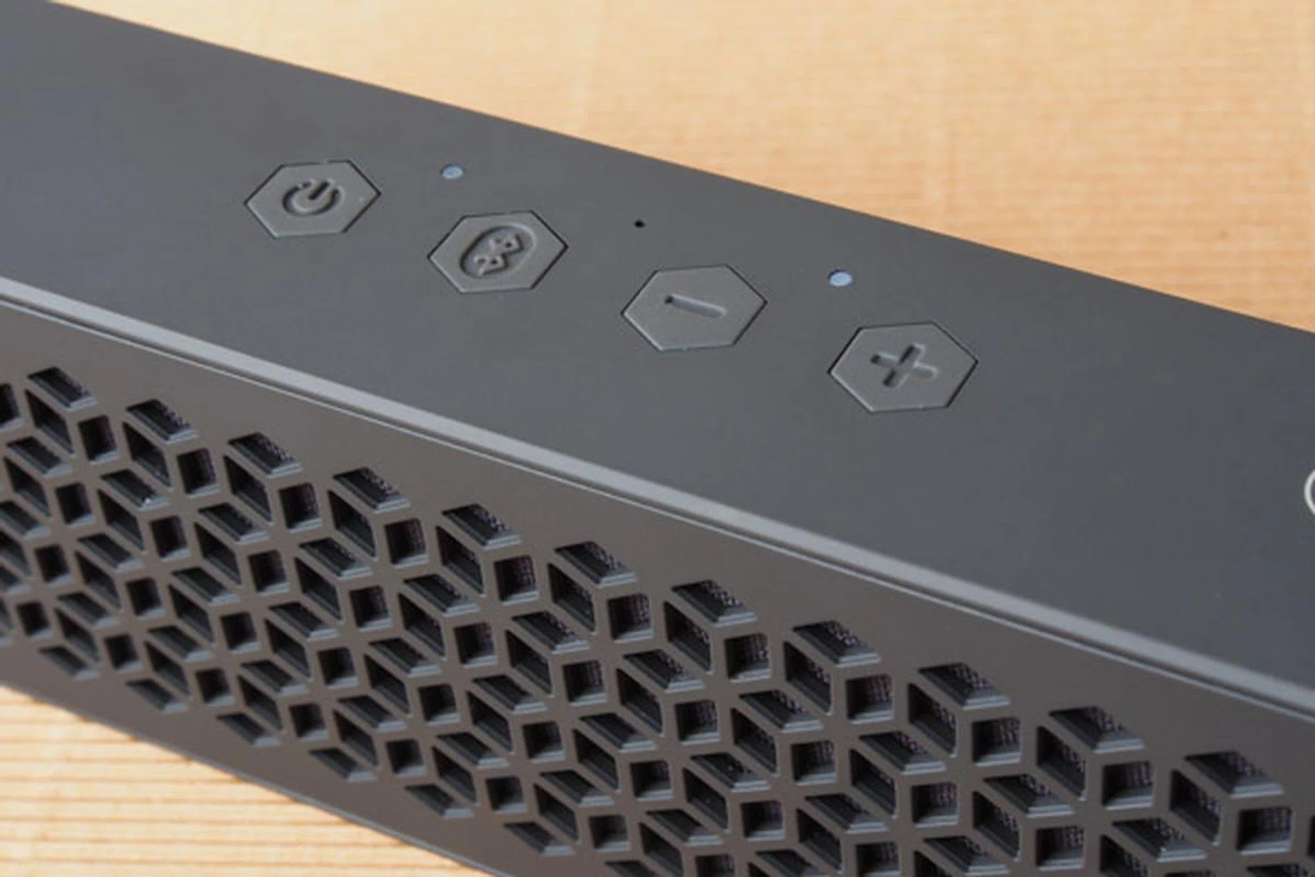 Power button, Bluetooth pairing button, and volume controls fill the top of the MuVo Mini.