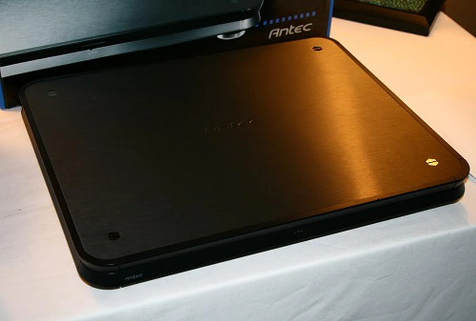  Beyond the realm of chassis and its related components, Antec also had this A/V cooler base unit, which facilitates close stacking of A/V equipment while keeping the unit below cool. At the bottom of this base are dual silent blower fans that pull and channel warm air to the back; this design comes in handy when you have limited space and need to stack a component (such as a DVD player or others) over an amplifier for example.  