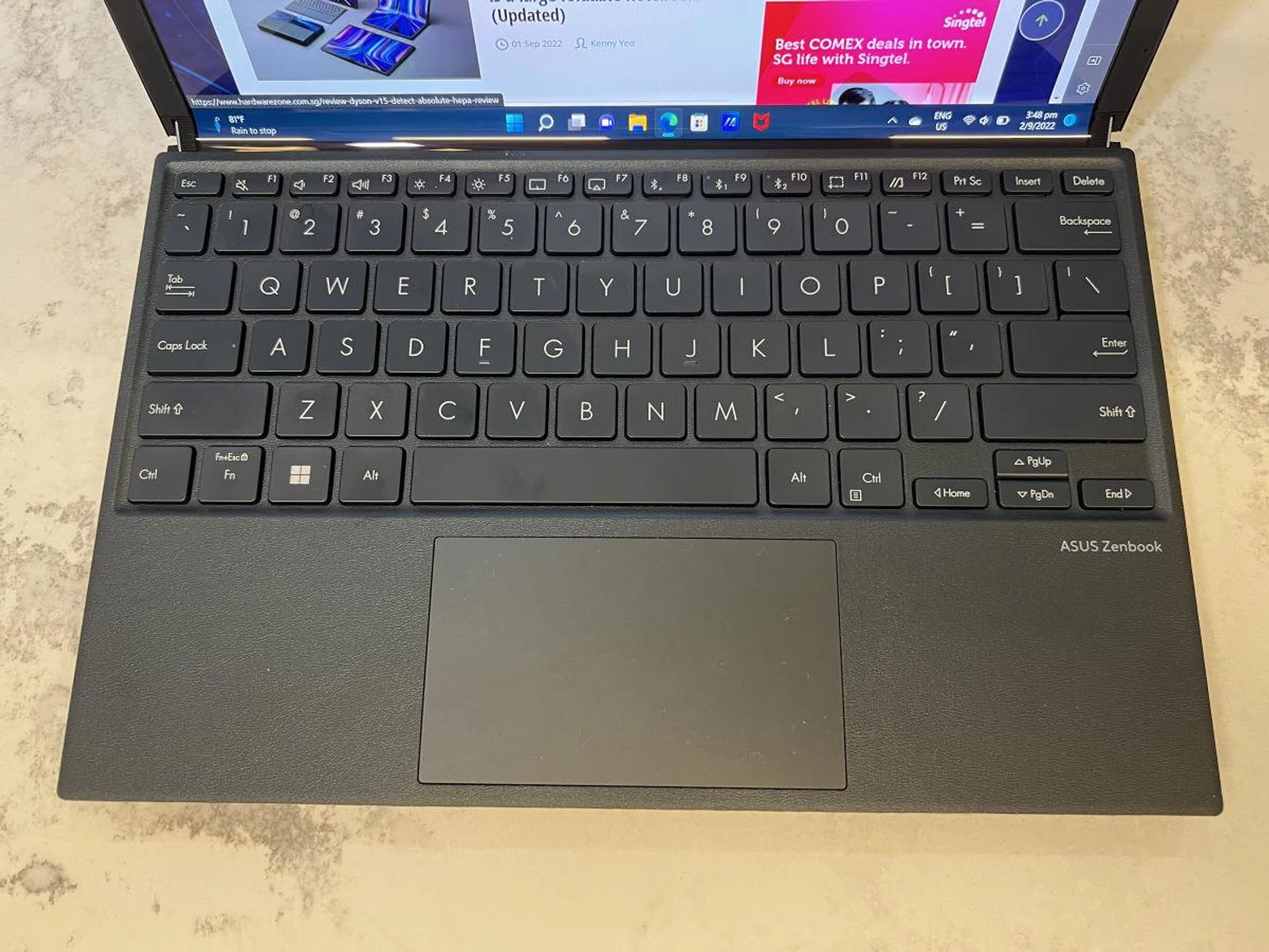 The ErgoSense Bluetooth keyboard is nice to type on, with a large trackpad area and solid, textured palm rest areas, but there is a lot of flex in the middle as you type since the keyboard rests above the display..