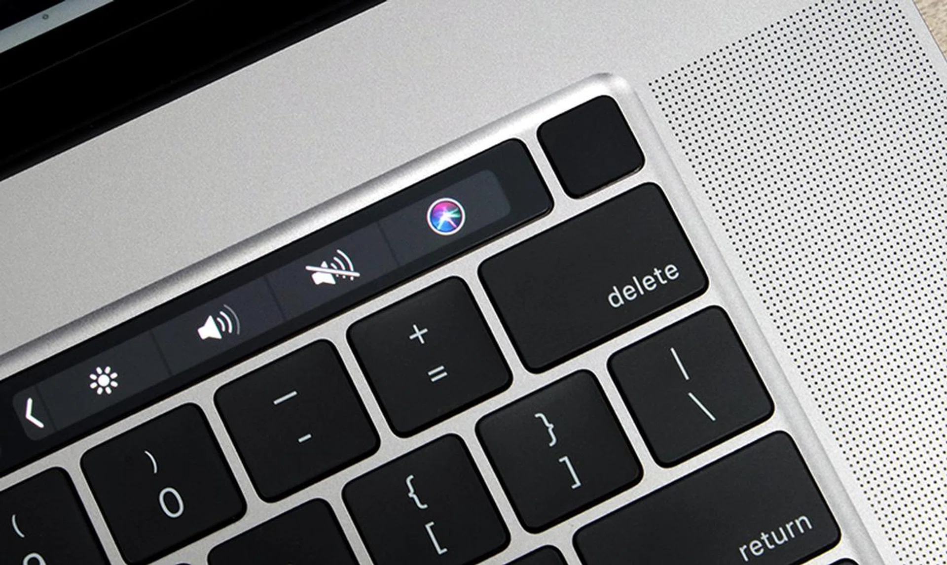 The Touch ID / power button is now separate from the main Touch Bar strip.