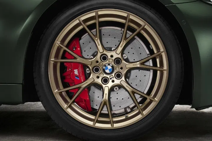 Carbon ceramic brakes are standard as are the gold wheels. (Image source: BMW)
