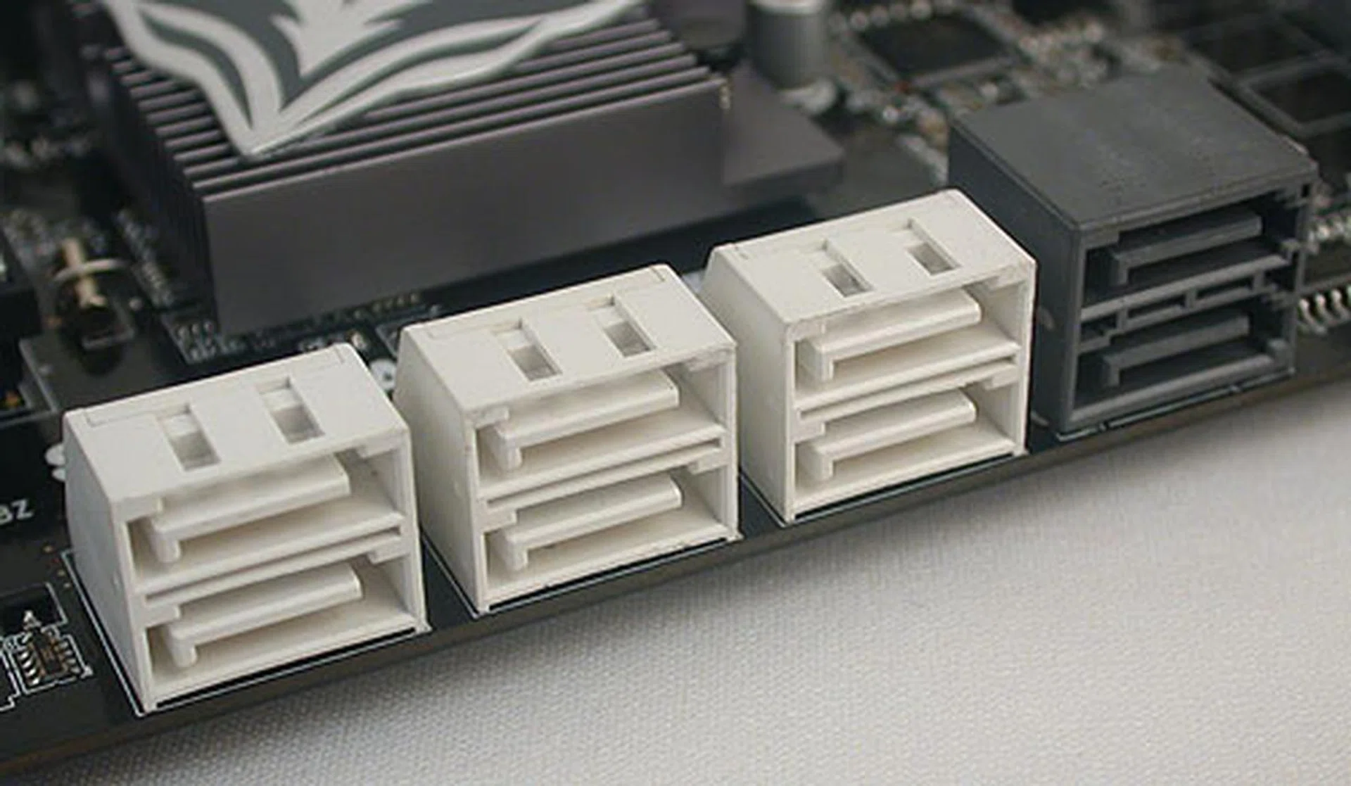 Six SATA 3.0Gbps ports (in white) and two SATA 6Gbps ports (in black), an increasingly common sight on newer motherboards. Marvell's 9128 SATA 6Gbps controller is used, with SATA RAID support.