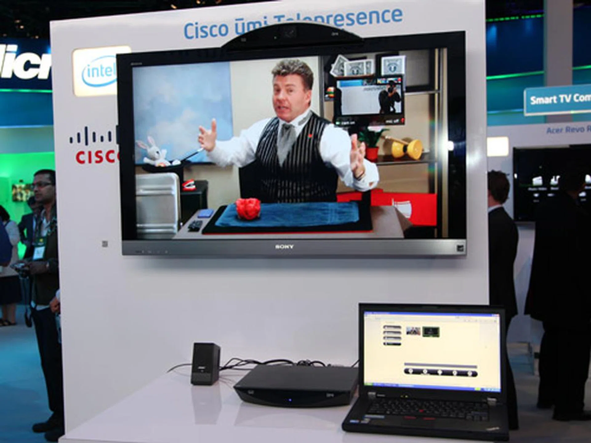 Demonstration of the Cisco Umi video conferencing device which lets you make video calls at full 1080p resolution. Seen here, a magician from Los Angeles performing live tricks to CES visitors in Las Vegas.