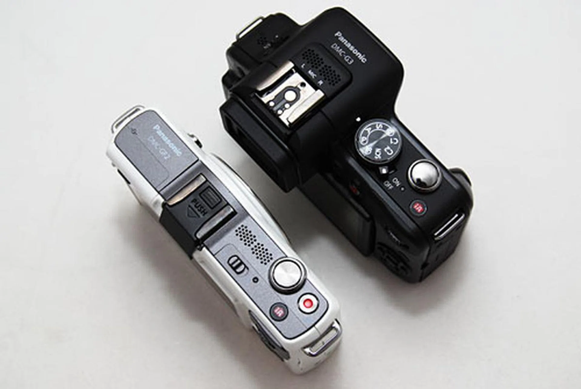 The top plate has less controls than the GH2, and you can see it was designed for simple usage like the GF2.