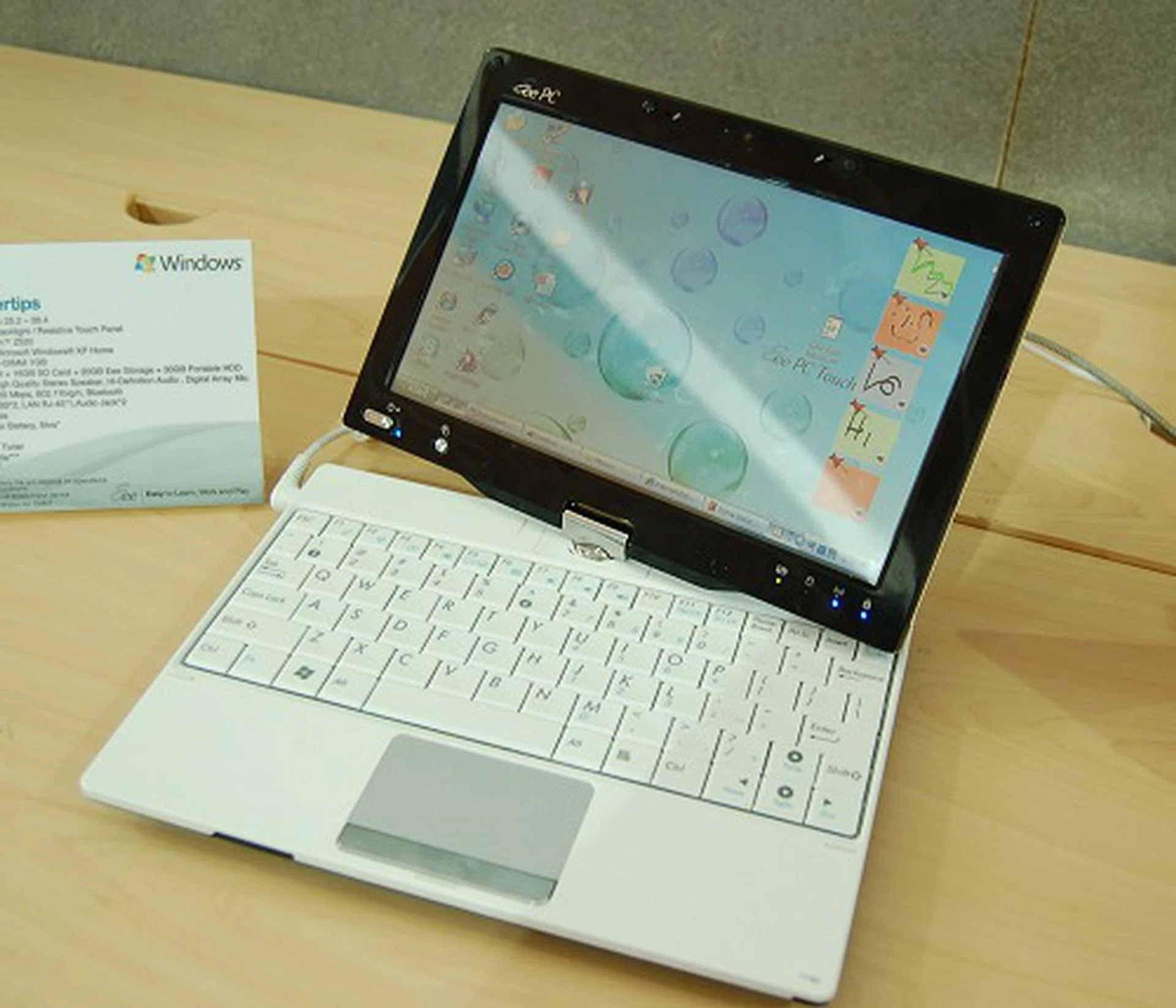  Here's the recently launched ASUS Eee PC T91, a mini-notebook tablet if you will. They aren't the first to do so for the mini-notebook segment, but it's certainly looking more elegant. Using the similar Intel Atom platform (but using the less power hungry Z520 processor), it sports a 8.9-inch LED backlit resistive touch panel, 1GB DDR2, 16GB flash memory storage, expandable to 16GB more via SD cards and 20GB more via ASUS' Eee Storage online. Other specs include an array microphone, 802.11b/g/n wireless LAN, 0.3MP webcam. Comes with Windows XP Home OS. The keyboard however needs improvements in our trial usage. If that were bettered, it this mini notebook tablet would be a joy to use.  