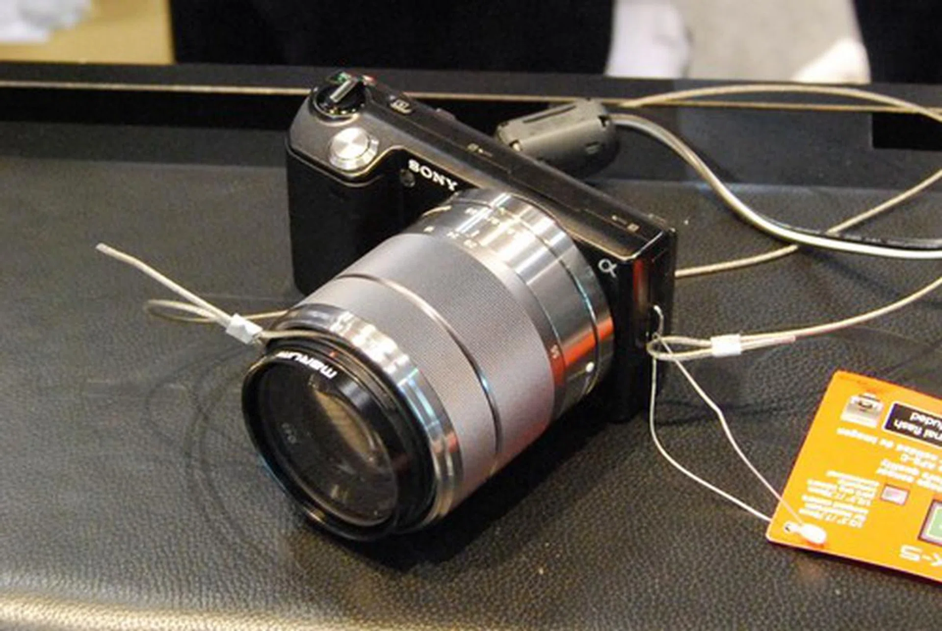 Spotted at the PC Show is Sony's latest NEX-5 camera, a compact-sized camera with a DSLR-sized sensor which can interchange lenses. For $1199 you get 14.2MP, full 1080i HD video recording and a 3" tilt-able screen. There's a 18-55mm kit and a 16mm F2.8 kit available.