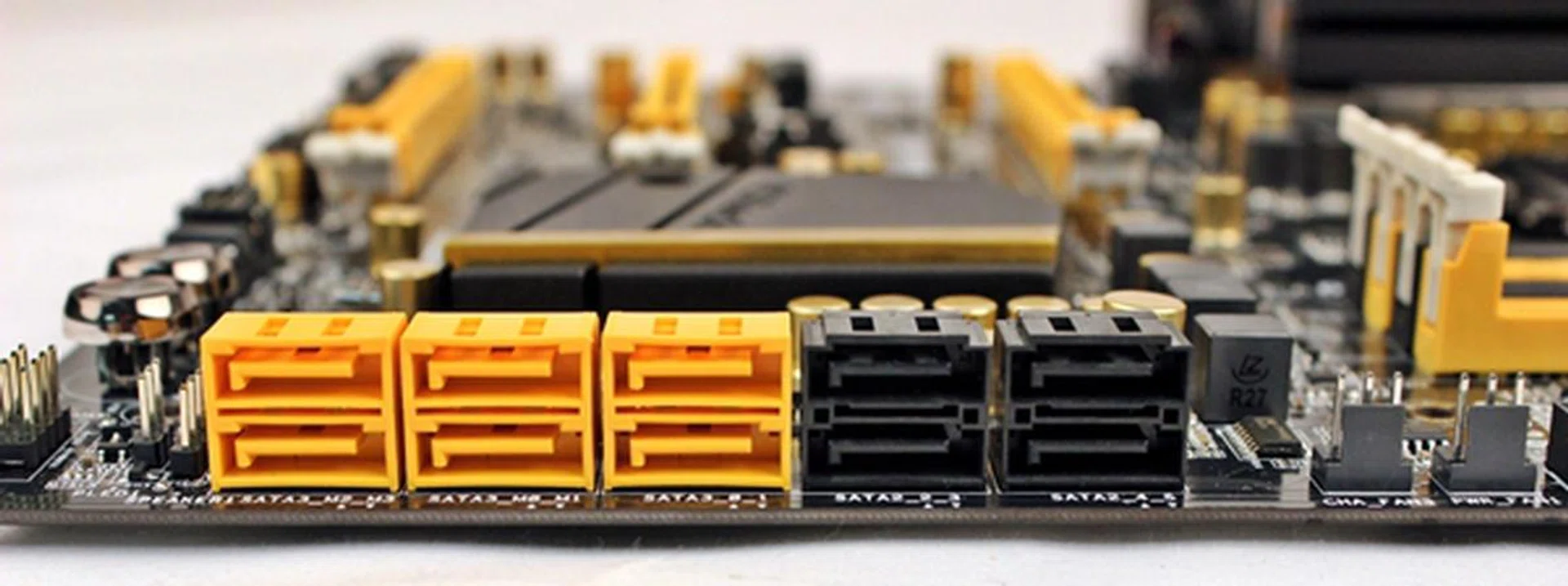 The yellow connectors are SATA 6Gbps-compliant while the black ones support SATA 3Gbps. There is no color differentiation among the yellow SATA 6Gbps connectors to determine their controllers; the pair on the extreme left are supported by the chipset, while the remaining four are courtesy of the Marvell controllers.