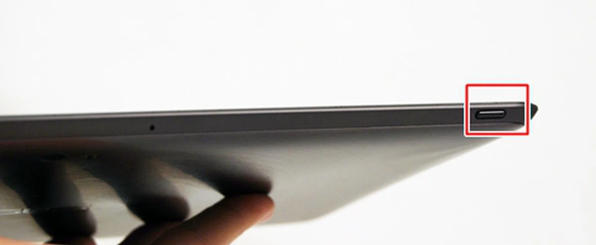 On the top left hand corner of the ASUS Eee Pad Transformer Prime is the Power button. There is more than enough space available for ASUS to design a larger button but unfortunately it wasn't made us such. There is also a tiny LED indicator on the button itself which lights up when you charge the tablet.