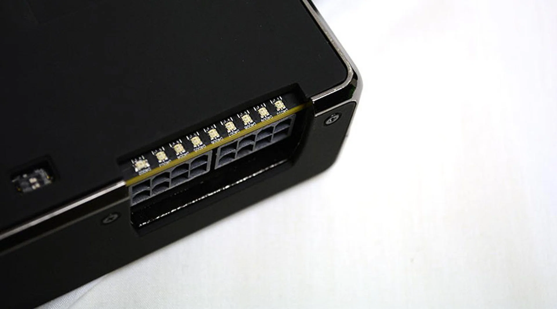 The row of LEDs above the PCIe power connectors can be configured according to the position of a pair of physical DIP switches.