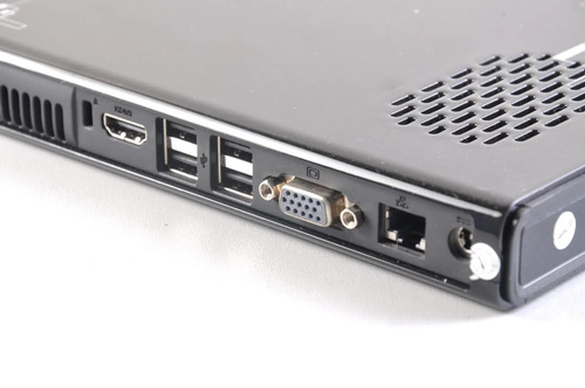 Seen from this angle are the connectors found on the rear side of the unit. For such a compact system, the i51 packs an impressive amount of connectors. Here are the single HDMI port, four USB 2.0 ports, RJ45 Gigabit LAN port, VGA port, and the DC-in connector.
