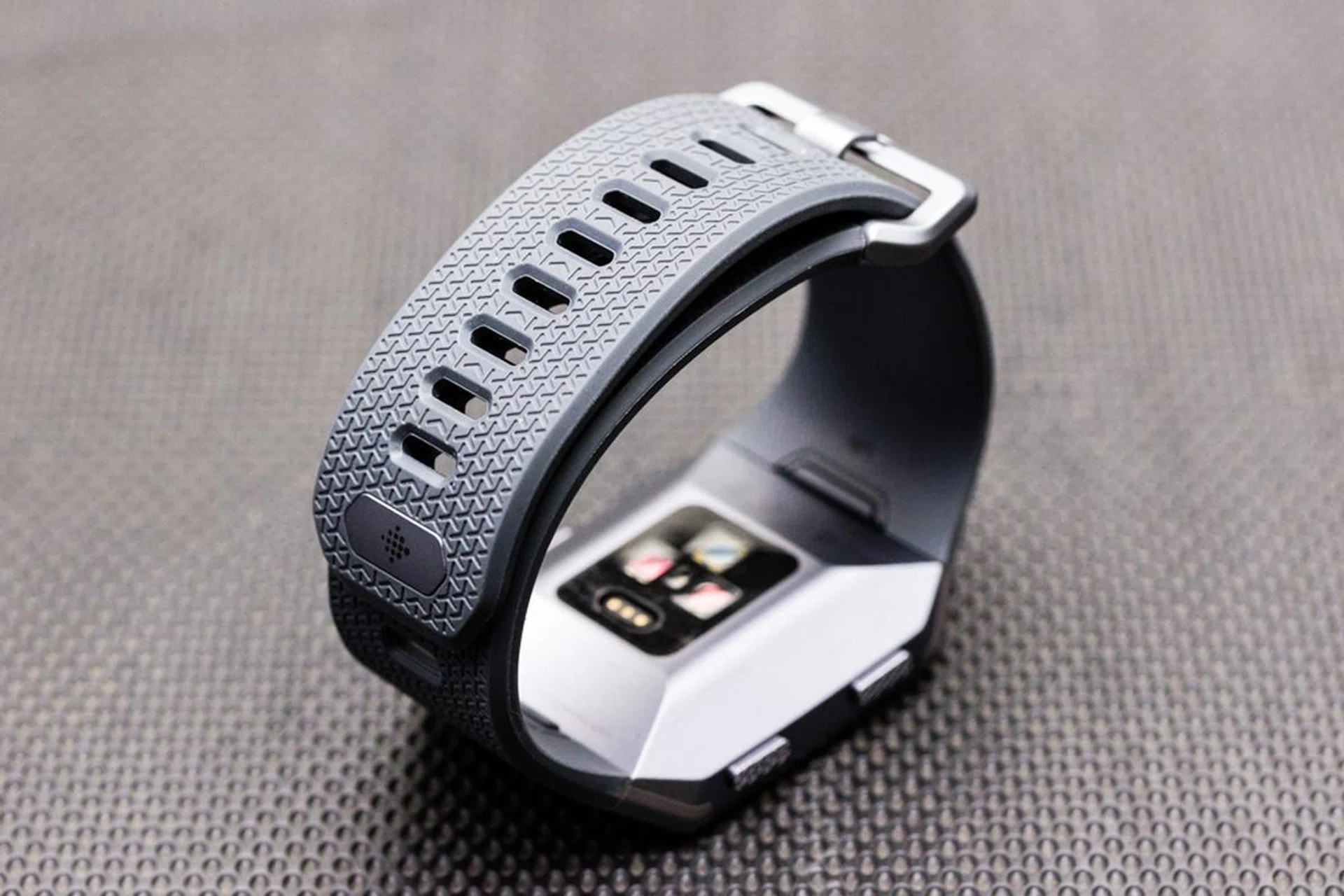 The strap that comes with the Ionic is fine, the strap holes provide a basic level of breathability.