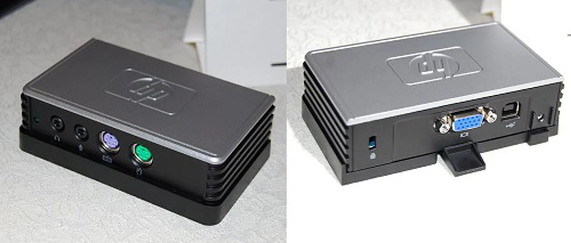 This is HP Multiseat t100 (thin client) device. While it's still termed as a 'thin client' device, it's nothing of that sort compared to traditional thin client and server architectures. This Multiseat device just acts as a gateway to the virtualized environment on the server with its own I/O devices. As you may have noticed, this model only has PS/2 and VGA connections. A quick check with the executives revealed that other configurations like USB and DVI are possible for more advanced environments.
