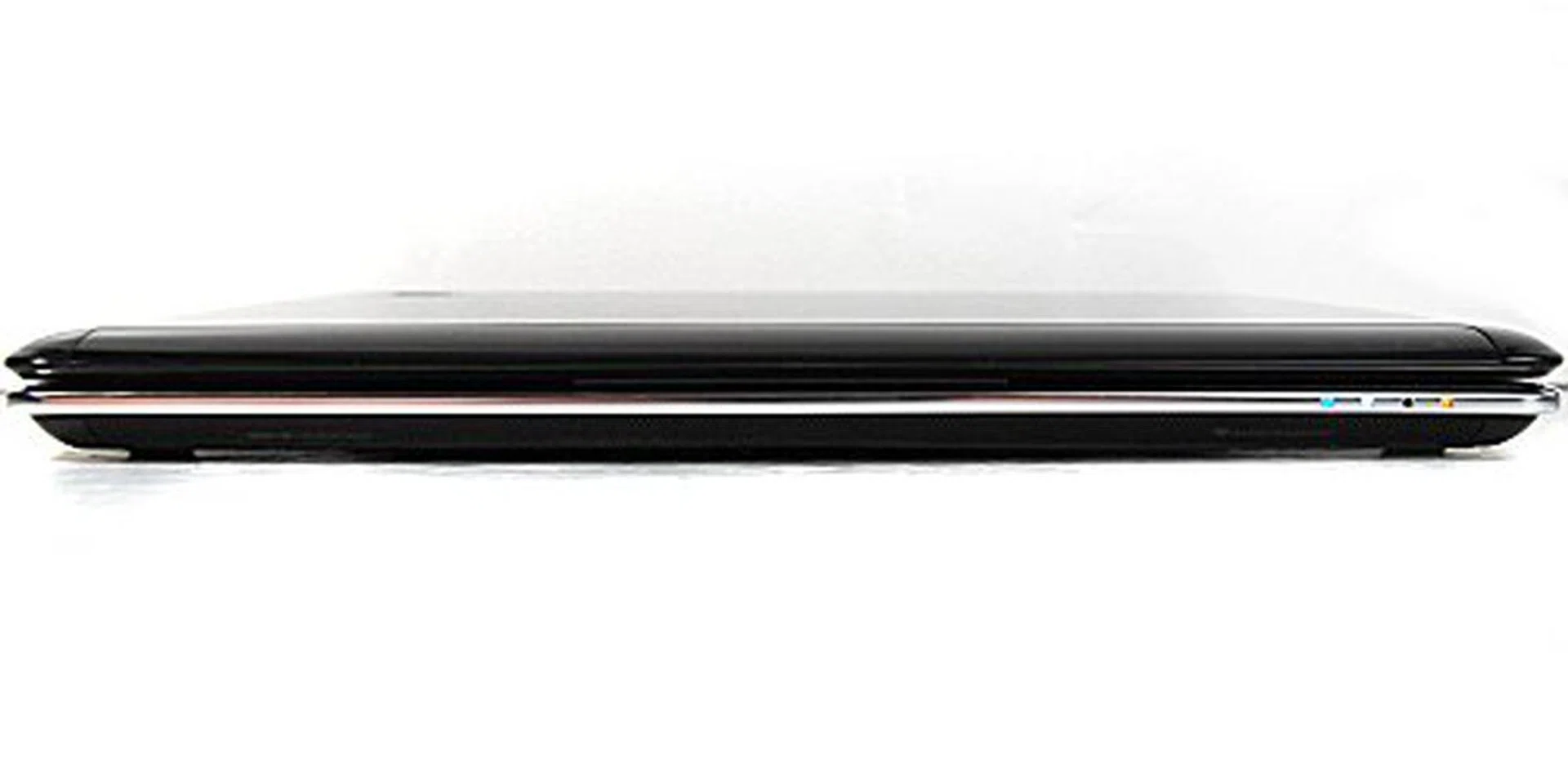 The front uses a beveled edge to simulate the appearance of thinness, while also concealing the stereo Altec Lansing speakers.