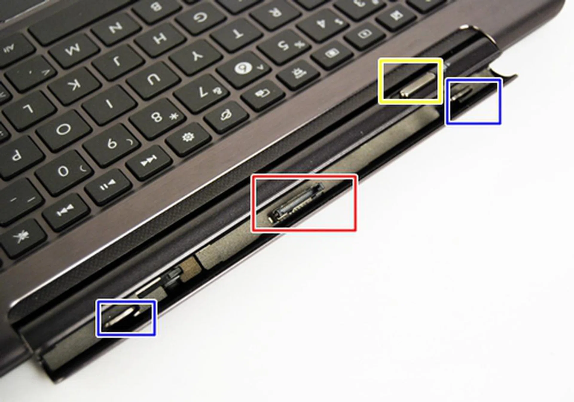 You connect the keyboard docking station via the 30pin connector in the center (red box) and the two latches (blue boxes). The slider switch (yellow box) allows you to lock or remove the tablet from the docking station.