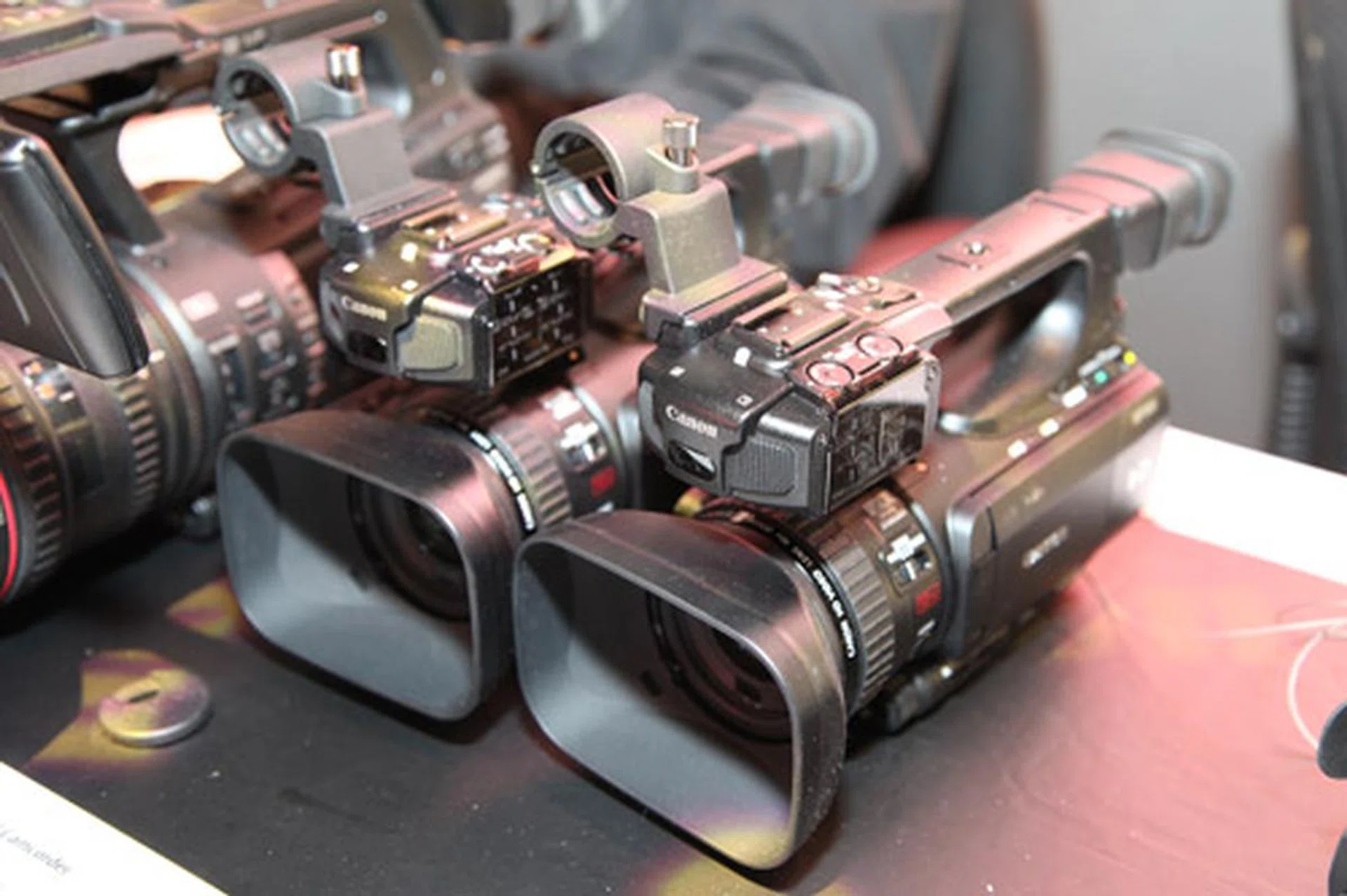 The new Canon XF105 and XF100. The two new camcorders utilizes the same Canon XF Codec featured in the earlier successful models XF305 and XF300, an MPEG-2 4:2:2 50Mbps codec used for exceptional high-definition image quality.  Comes with 30mm wide angle lens with a 10x zoom and new SuperRange Optical Stabiliser (OIS) offering 2 different modes of stabilisation.
# Record on 1080/50i, 1080/25p, 720/50p and 720/25p modes 