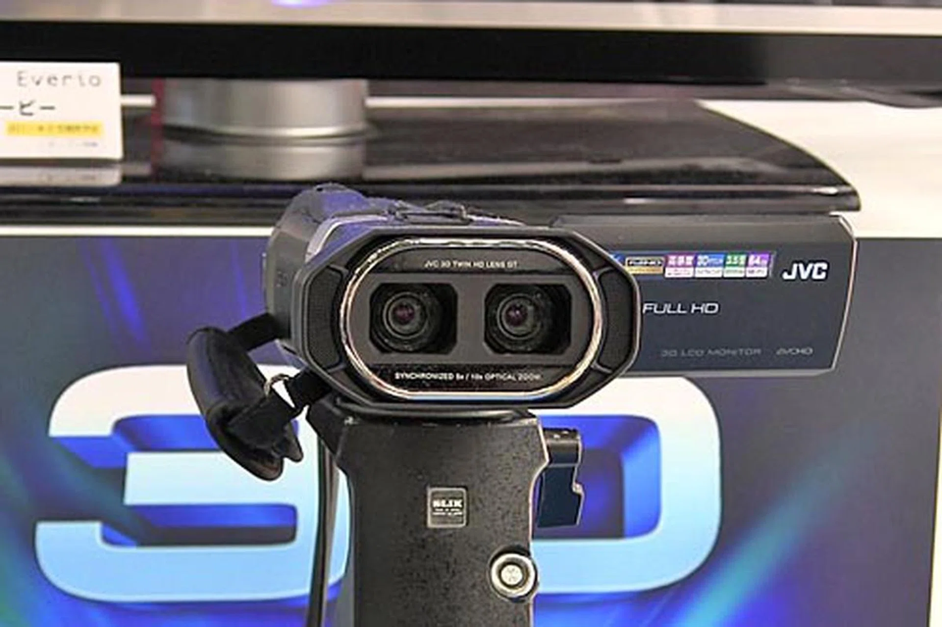 No, this isn't WALL-E. This is the JVC Everio GS-TD1 Full HD 3D camcorder. It uses two camera lenses, and two 3.32-megapixel CMOS sensors (one for each lens). It also has a 5x zoom lens, and a 3.5-inch touch LCD.