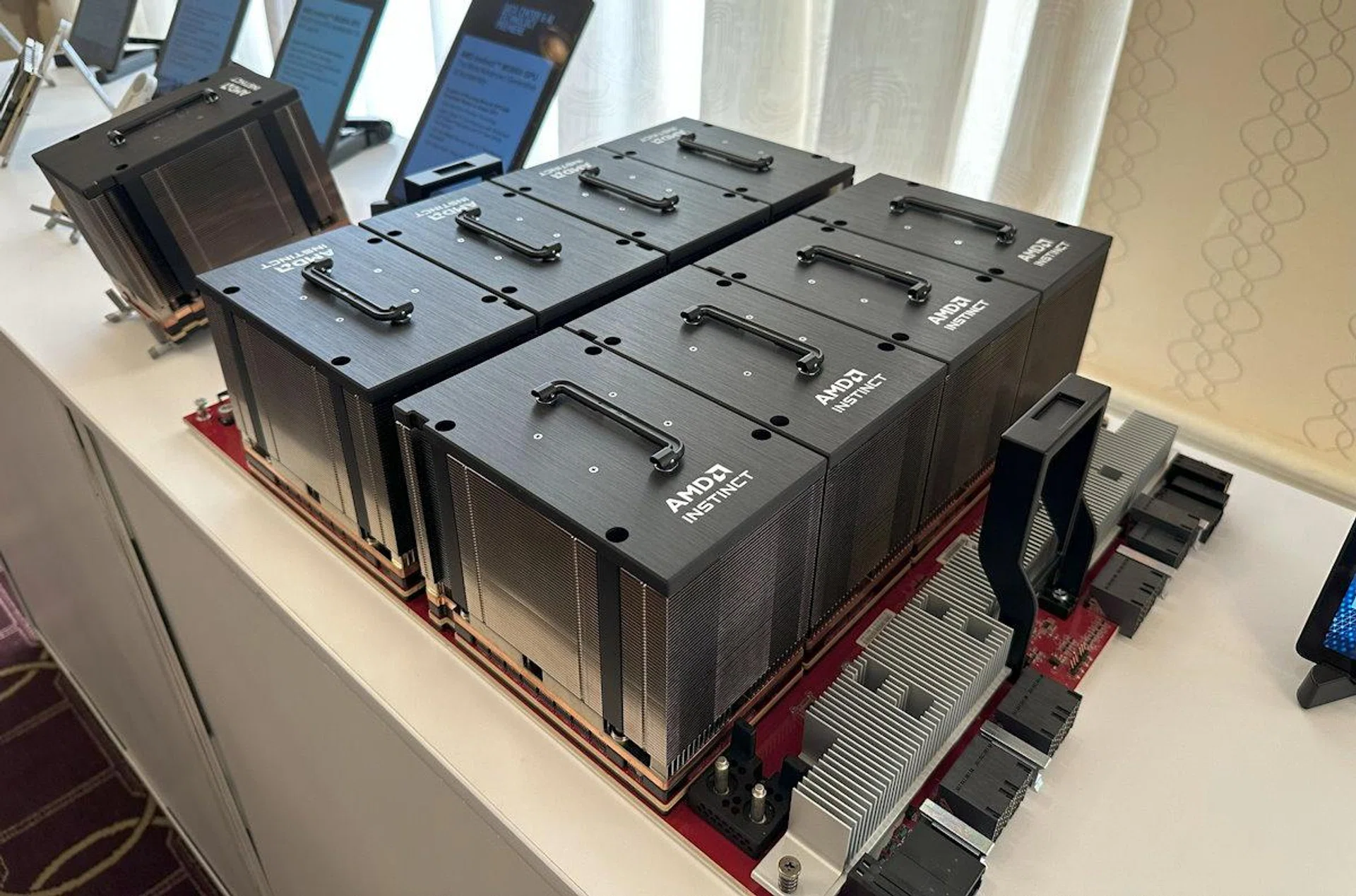 The AMD Instinct Platform, and next to it on the left, a single Instinct MI300X GPU.