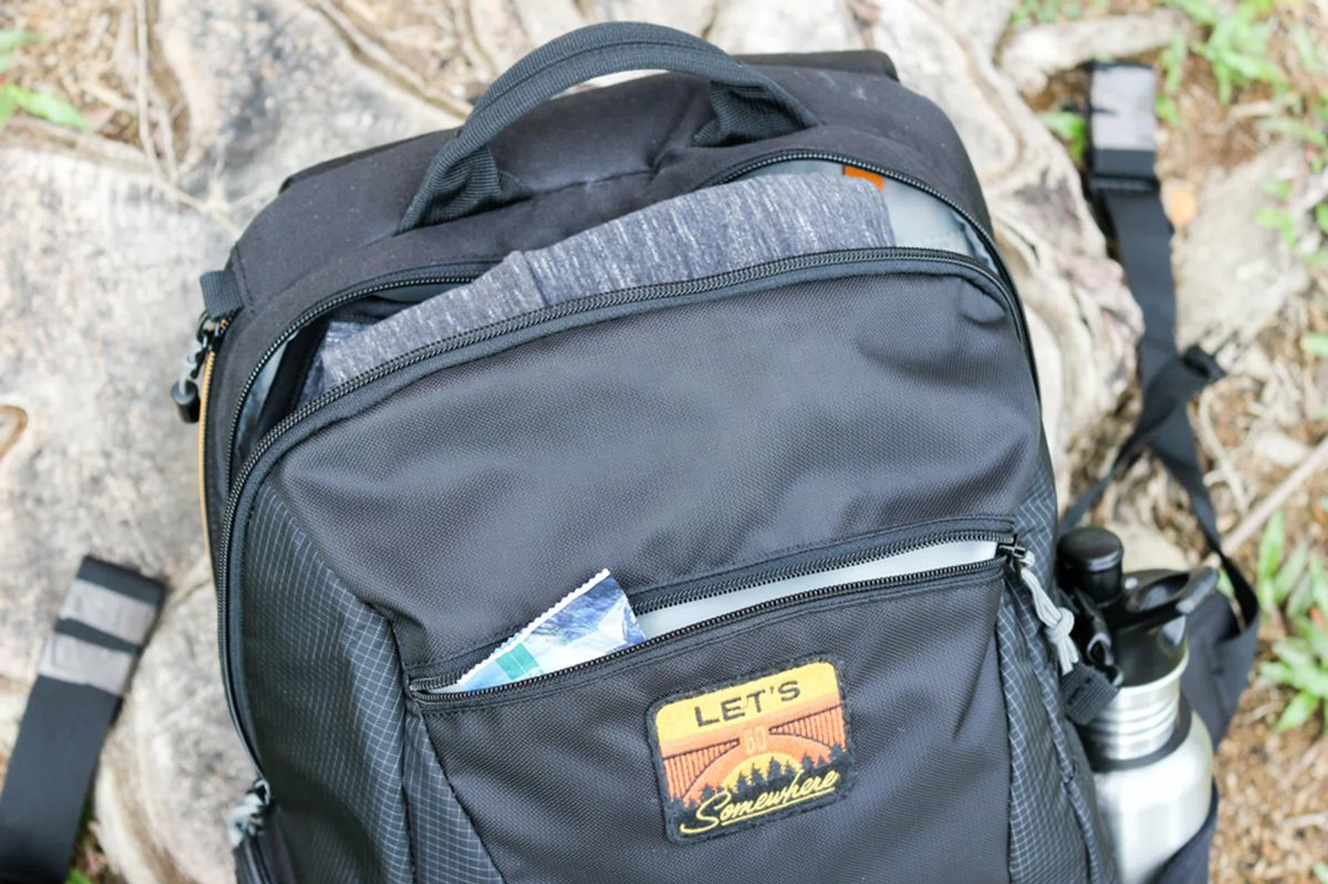 A front pocket lets you hold miscellaneous small items, like a protein bar. I covered the Lowepro logo with a custom patch.