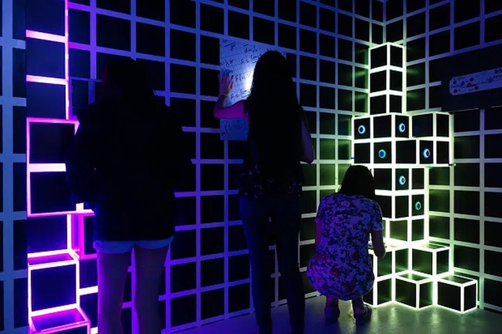 Here's a sample of one of the escape rooms and its participants busy solving the puzzles.