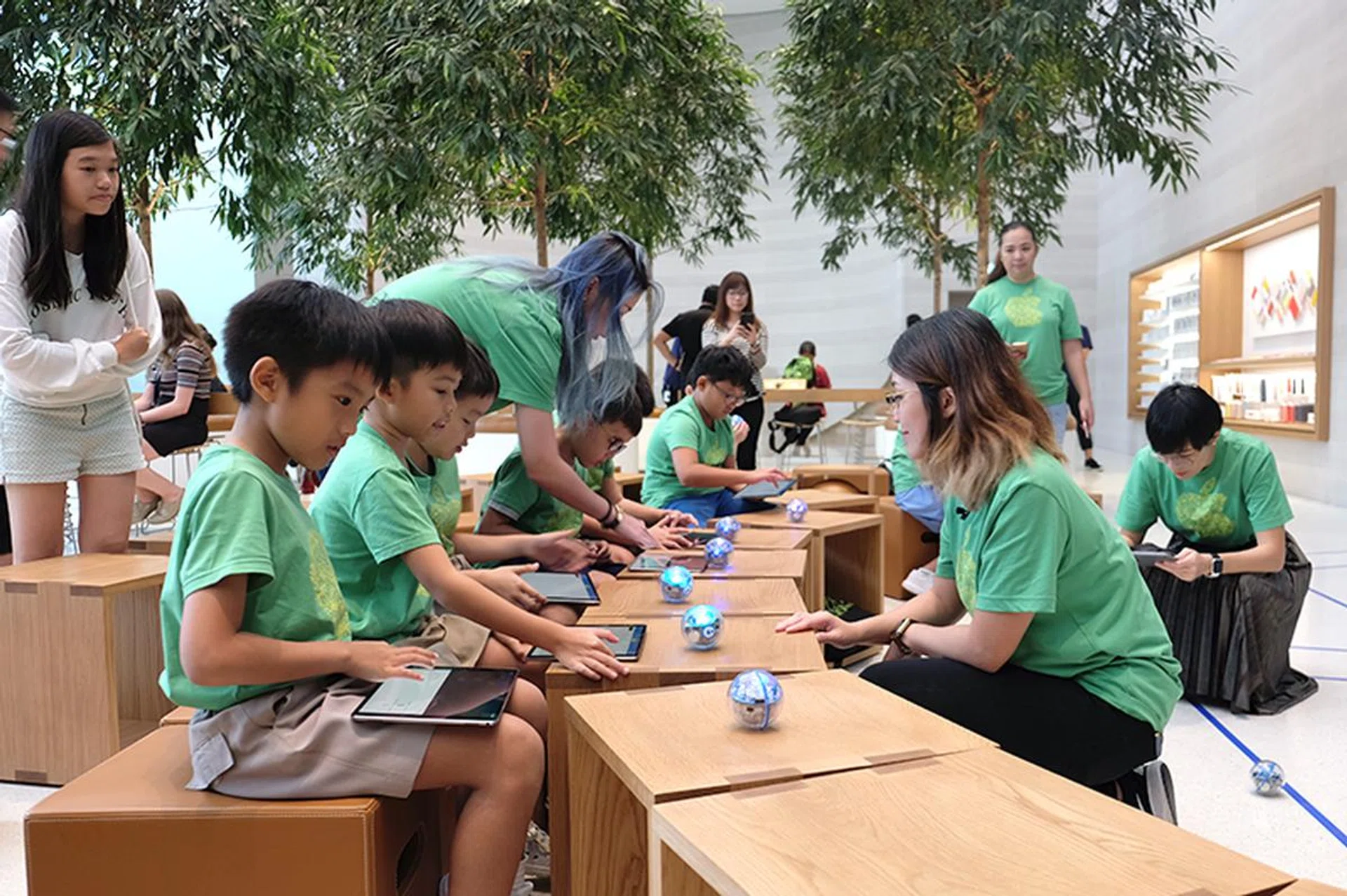 The kids receiving their iPads and Sphero robots.