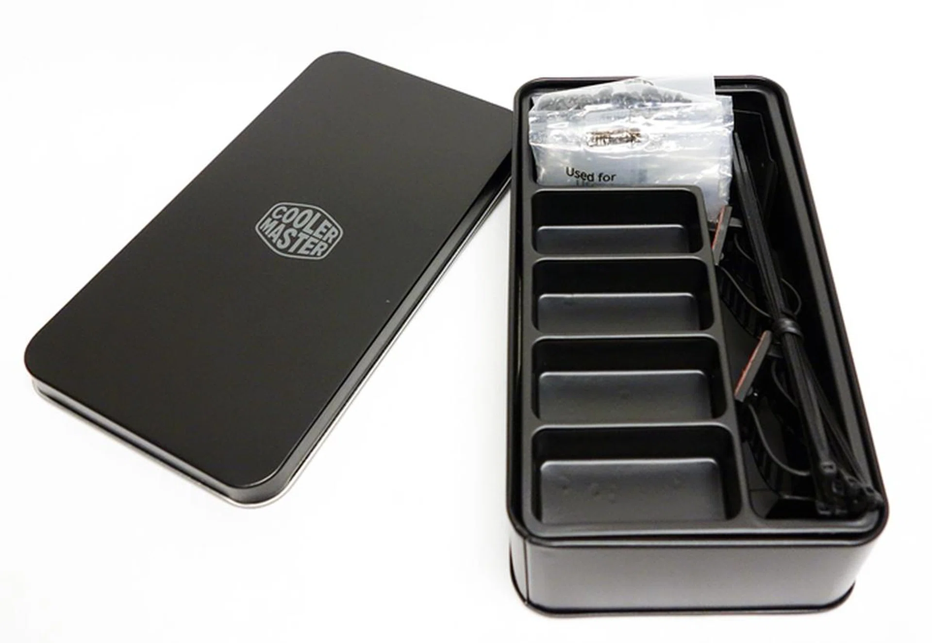 The accessories aluminum box is a change from usual cardboard-based packaging.