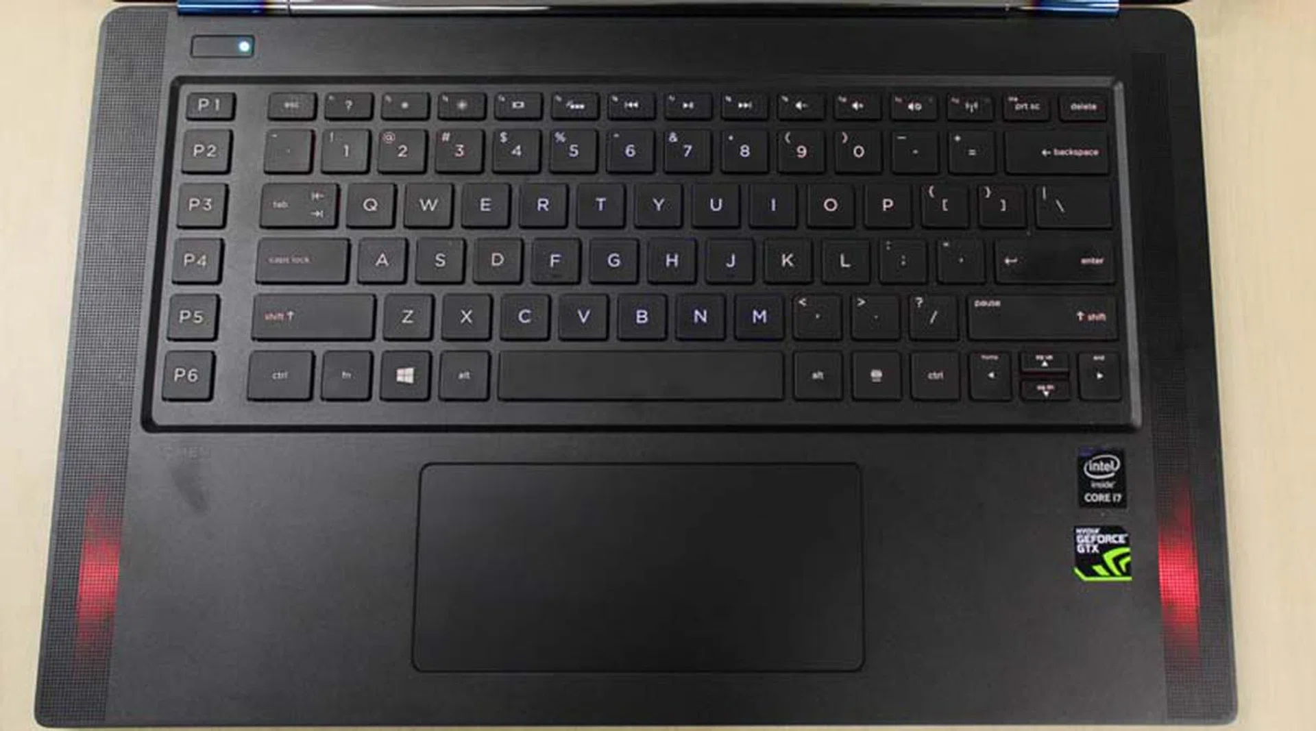 The backlighting isn't that strong. In this shot, it's actually turned on, but you can barely make out the red tint to the keys.